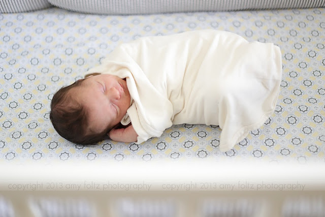 photo of a baby sleeping in his crib