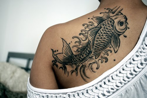 Koi fish tattoo on shoulder blade