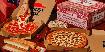 Pizza Hut's Triple Treat Box with its contents displayed.