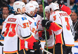 The Calgary Flames are off to a fine playoff start, and the San Jose Sharks can start worrying again. Stephane Yelle scored two goals, Miikka Kiprusoff made 37 saves and the seventh-seeded Flames stunned the NHL's second-best regular season team in their first-round opener, beating the Sharks 3-2 on Wednesday night. (Photo: Don Smith/NHLI via Getty Images)