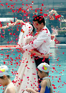 Chinese Couple Holding Wedding Ceremony in Swimming Pool