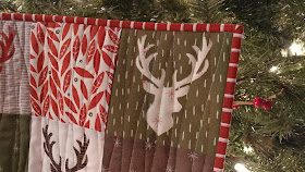 Christmas deer quilt using Merrily by Moda and Aurifil thread