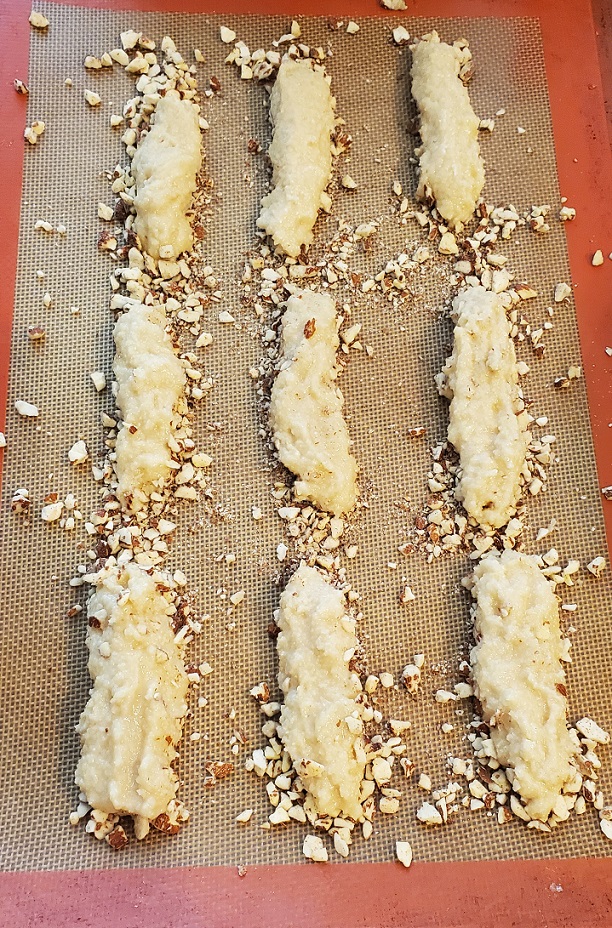 almond stick cookies raw on cookie sheets
