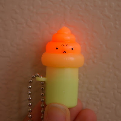 Now if Poop on a stick with a sad face that lights up wasn't weird enough,