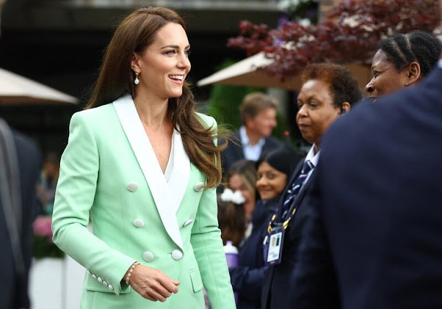 Princess of Wales wore a mint double-breasted two-tone crepe blazer by Balmain. Shyla Knot baroque pearl earrings