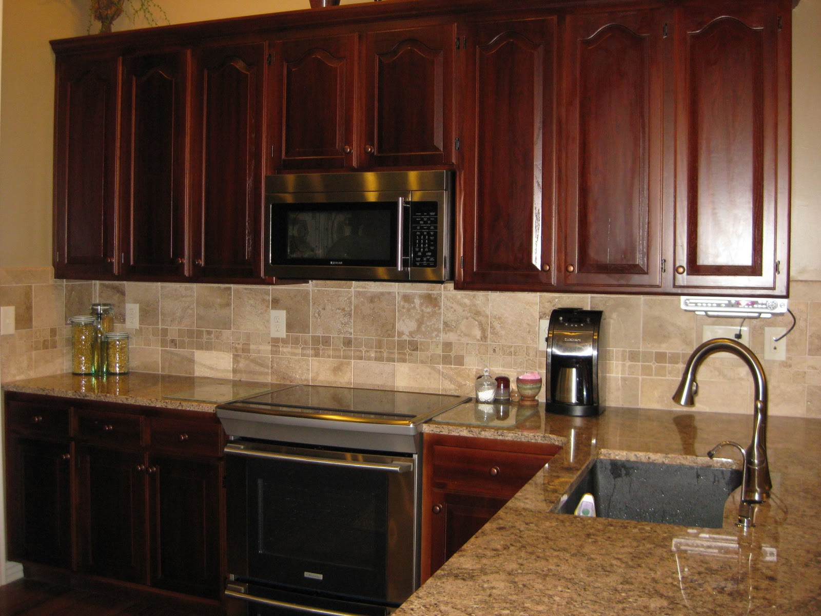 Re-colored kitchen cabinets. Added new hardware. Modified cabinet 