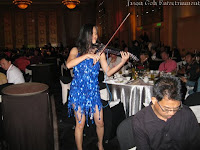 One of the violinist from the Electric Violin Group serenading the guests at IME's event