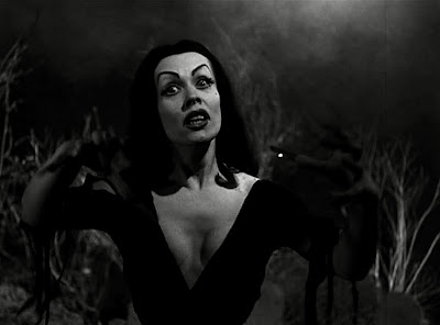 Vampira strikes a goth glamour pose