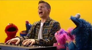 Charlie Puth teaches Grover about making music, then performs Sing with Grover, Elmo, Abby, and Cookie Monster. Sesame Street Episode 5005, A Dog and a Song, Season 50.