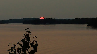 Sun setting with clouds bands