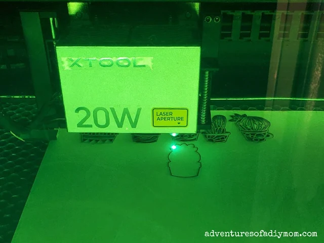 xTool S1 20W laser cutting machine cutting succulents out of 3mm basswood.
