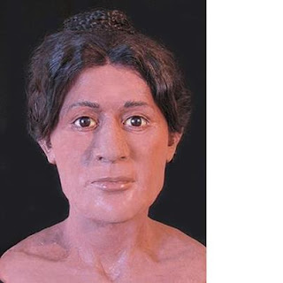 Nearly 2,000 years ago, at a time when Egypt was under the control of the Roman Empire, a young woman with an elaborate hairstyle was laid to rest only yards away from a king's pyramid, researchers report. She was 5 feet 2 inches in height, around age 20 when she died, and was buried in a decorated coffin whose face is gilded with gold. A nearby pyramid, at a site called Hawara, was built about 2 millennia before her lifetime. The location of her burial is known from archival notes. High-resolution CT scans reveal that, before she was buried, her hair was dressed in an elaborate hairstyle.