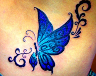 blue butterfly tattoo on breast girl