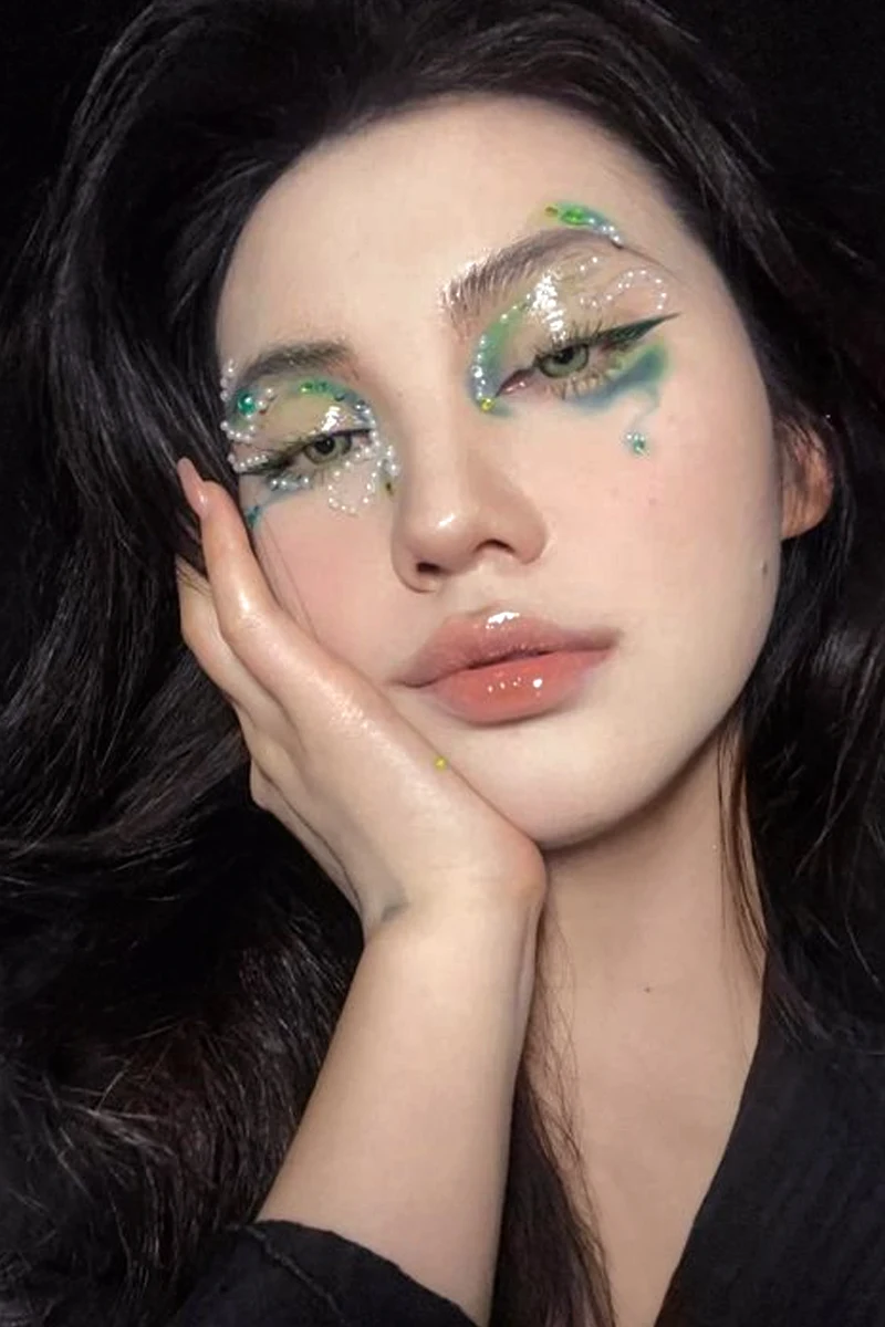 a portrait of a beautiful woman with a fairycore-inspired makeup look