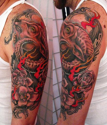 Ram with roses tattoo.