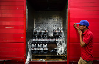 The food and beverage industry, where the supply chain is already feeling the effects of climate change on crops and water supplies, has the largest percentage of big companies setting greenhouse gas emissions goals with deadlines. (Credit: Ronaldo Schemidt/AFP/Getty Images) Click to Enlarge.