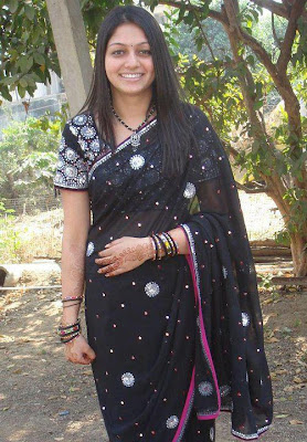 Modern Mumbai girl wearing black color saree. 