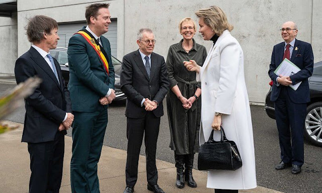 Queen Mathilde wore a new white cashmere long midi coat by Giorgio Armani, and black turtleneck sweater and black trousers