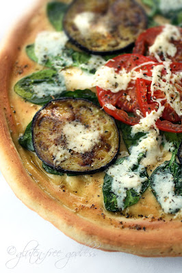 Italian style gluten free pizza dough baked to a tender crust and topped with fresh grilled eggplant and vegan cheese