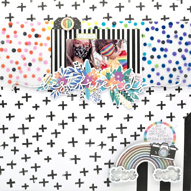 Best friends scrapbook page with black & white papers and a colorful splash of rainbow embellishments, including a shaker filled with glitter and mica flakes.