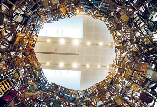 Japanese artist Tadsahai Kawamata went all out for the fourth annual Abu Dhabi art fair. Kawamata, created a round tower formed out of thousands of chairs. The piece, entitled Chairs For Abu Dhabi, is a twenty-foot tall sculpture that took five days to complete.