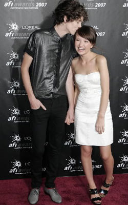 Actress Emily Browning gets a kiss from boyfriend Max Turner at AFI awards in Melbourne Pic