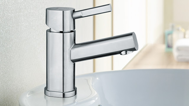 Modern chrome bathroom sink faucet.