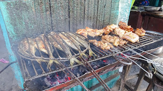 Fish and monkey on barbeque grill in Brazzaville