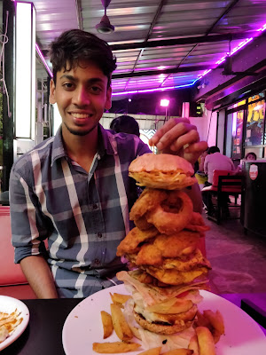 The cherry tomato is a burger and rolls cafe in Margao. The zombie burger is one of their signature burgers consisting of onion fries, potato wedges,  chicken, patty  (chicken or beef), crepes, bacon and much more. Have you seen the size of that burger? It's literally a serving for minimum 3 people. Do not try to eat that alone. It is highly dangerous and you will end up getting fat (except for my friend - he's forever haggard)