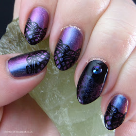 Lace stamped nail art over multi chrome color shifting polish.