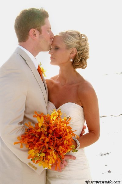 Stunning bouquet of small yellow and orange orchids