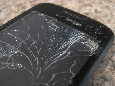 Broken smartphone screen "Droid Eris meets pavement" by robertnelson is licensed under CC BY 2.0