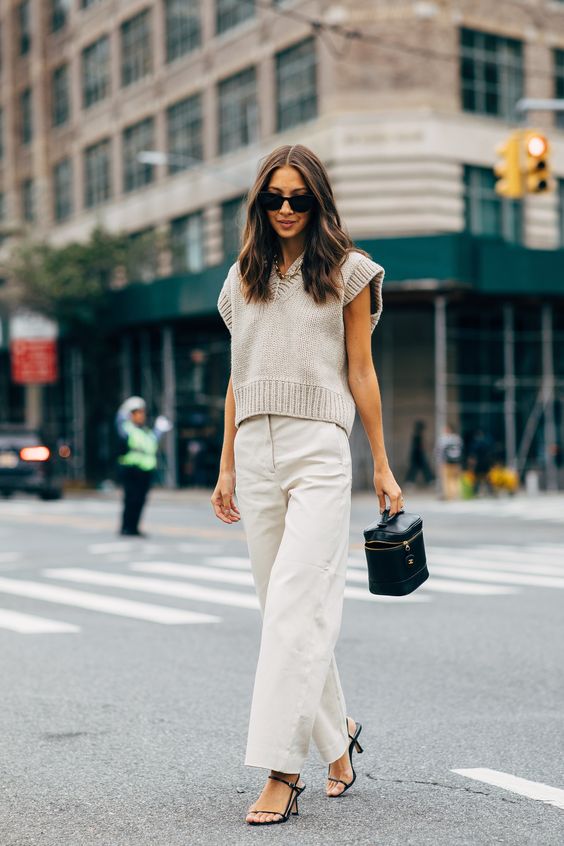Fall Trend: Felicia Akerstrom in a sleeveless sweater, beige pants, and strappy heels