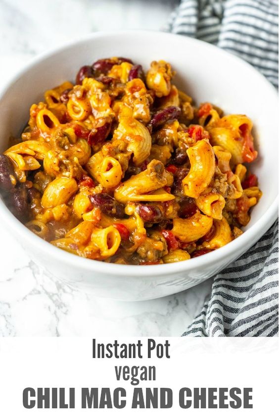 This Instant Pot Vegan Chili Mac And Cheese is the best one-pot comfort dish ever, it is warming and flavorful, elbow pasta, kidney beans, onion, garlic, bell pepper, spices cooked in flavorful broth, finished off with vegan shredded cheese. So hearty and satisfying. #macandcheese #pasta #vegan #glutenfree