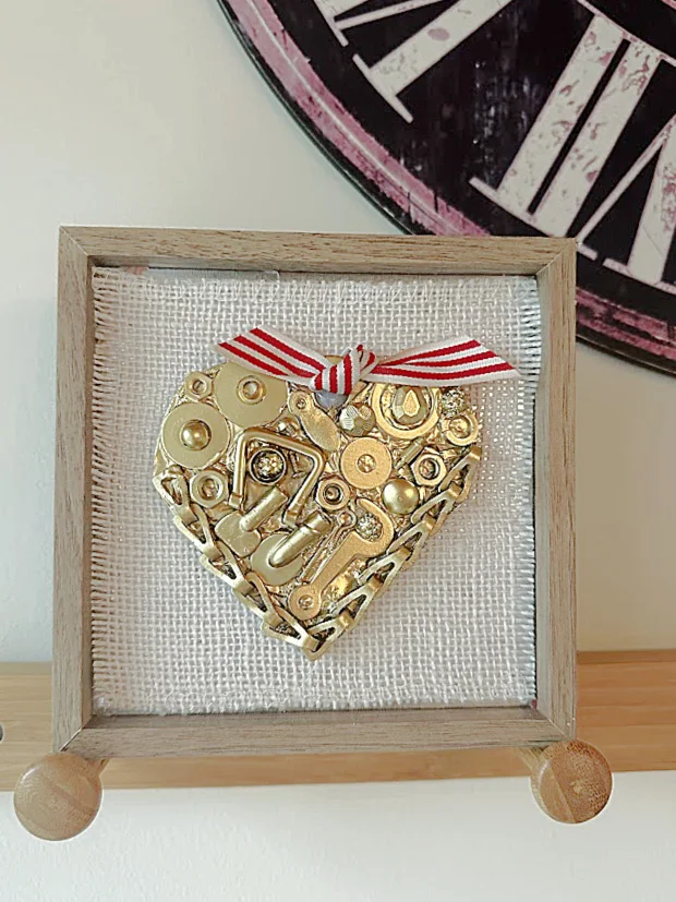 framed heart with clock and pegs