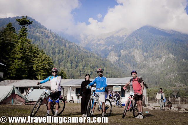 After full day rest at Kullu Sarahan, it was time for get ready for next journey towards Jalori Pass and back to Shimla via Dhomri (Narkanda) ... All the riders were comparatively more energetic and passionate about the stages of MTB Himachal !!! Here is a small PHOTO JOURNEY of 5th day morning, when we had to move towards Bahu !!!It was right time to have some clicks of these riders at this beautiful camping site of Kullu Sarahan... But there was no one to co-ordinate and I was not in a mode to pull each of the rider and ask them to say cheeze... So captured some of them who were around the place...Warm-up sessions at Kullu Sarahan, during Mountain Terrain Biking, Himachal Pradesh-2011 Suddenly more folks from Nepal team, Army group and Noida gang joined in and happily cheering for our next journey of Mountain Terrain Biking Himachal 2011...Here come the Army team and Monika hopping in with big cheer for the team !!!Route of Day-5 of Mountain Terrains Biking, Himachal Pradesh, 2011 was ::Bagipul == Urtu == Garshaain == Damah == Kandagahi == Amarbaag == Chuaai ==Shamshar == BaahoSudhir, Vikas, Gouri and Siddhartha - The Noida Gang at Mountain Terrain Biking, Himachal Pradesh, 2011 !!!Our own, Mr. Darshan Singh Ji... He was comfortably dragging his cycle on this bridge and picked it up after seeing the Travelling-Camera !!!This lady was here to participate and had come with her little baby. During day time, one of her relative used to take care of this baby. She used to find some time during free stages to meet him and make sure that everything is fine. Unfortunately on last day, baby had very high fever and she had to quit the race in between.Sarahan goats are coming towards our camps to wish good luck for next journey of MTB Himachal 2011 !!Ohh.. Here are our Marshals !!! Arjun had posed for his photograph but most of us were not aware that why he is standing like this :) ...Finally he got this opportunity of posing again.. that's too with black ScorpiowithOfficial sticker on it :) ... Yo Man !!!Mr. Gagan also wanted to have a similar shot but Arjun also chipped in :)