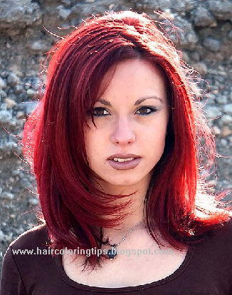 light brown hair with golden highlights. Dark red hair highlights in