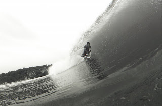 Justin Unsworth waving inside a barrel in Mexico