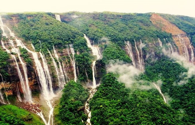 Shillong-Cherrapunji-Mawlynnong Tour (4Nights/5Days)    Day 1 : Guwahati Airport / Railway Station to Shilong  On arrival at Guwahati airport / Rly station welcome to our Representative & transfer to Shillong. On the way visit Umiam Lake/ Barapani lake. Check in Hotel & Rest of the day free at leisure. Night halt at Shillong.    Day 2 : Excursion trip to Cherapunjee  After breakfast excursion trip to Cherapunjee. Visit Noh kalikai falls, DwanSyiem view point, Mawsmai caves, Seven Sister water falls. Afternoon back to hotel & Rest of the day free at leisure. Night halt at Shillong.    Day 3 : Shilong city tour  After breakfast city tour in Shillongvisit Ward’s Lake, Botanical Garden, Lady Hydari Park, 18 hole Golf Course, Zoo & The State Museum, Elephant Falls & Shillong Peak. Evening walk at Police Bazar for shoping. Night halt at Shillong.    Day 4 : Excursion trip to Dawaki & Mawlynnong  After breakfast enjoy Dawaki sightseeing visit Dawaki River side & Indo-Bangladesh Border and then visit a magical Paradise-Mawlynnong. The cleanest village of Asia 2003, you can enjoy small trek to visit Living Root Bridge & Machan 85 feet Sky walk. After visit return back to Shillong. Night halt at Shillong.    Day 5 : Shillong to Guwahati airport / Railway Station Drop  After breakfast check out from the hotel and transfer to Guwahati airport / Railway stationfor your onward journey.        Imagica Ticket, Ticket booking in ahmedabad, imagica Ticket, WaterPark Ticket, Imagica, imagica ticket at best price, akshar infocom, TRAVEL AGENT IN GHATLODIA, travel agent in science city, travel agent in sola, travel agent in ahmedabad, air ticket booking center in ahmedabad, air ticket chip, hotel booking, tour package in ahmedabad, 9427703236, 8000999660, akshar infocom  International Air Tickets || Domestic Air Tickets || Cruise Booking || International& Domestic Packages || Hotel Booking World Wide ||  Visa Services || Passport Services || Overseas Travel Insurance || Railway Ticket || Bus Ticket ||  Car Rental || Foreign Exchange || Western Union & Transfast Money Transfer Services & More...    Ground Floor-11, Vishwas Shopping Center Part-1, R.C.Technical Road, Ghatlodia, Ahmedabad - 380061. Contact No.: 8000999660, 9427703236  E-mail : travel@aksharonline.com, info@aksharonline.com, Shillong Tour Packages, Shillong Tour Agent in Gujarat, Guwati Tour Packages, Package booking in ahmedabad, cheap air ticket in ahmedabad