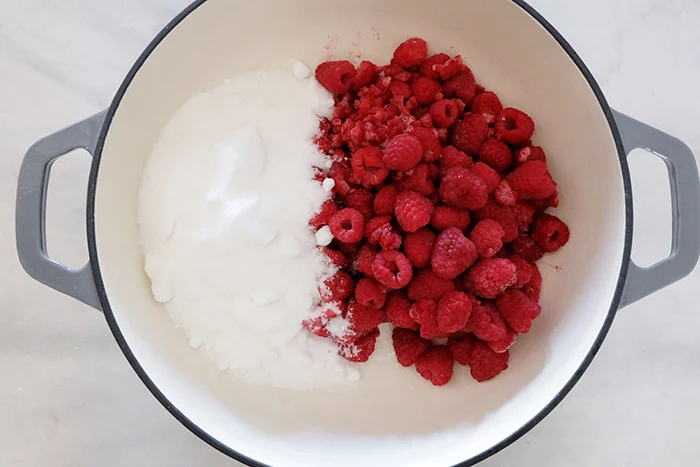 sugar and raspberries in dutch oven