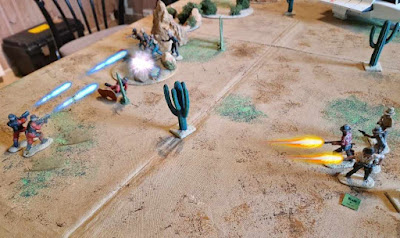 Playing free wargame rules with army men. Playing fubar wargame with a 1984 Visitor shock troopers vs. Cowboys wargame scenario. Cowboys vs Aliens
