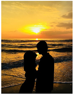 A couple in sunset during a mykonos honeymoon