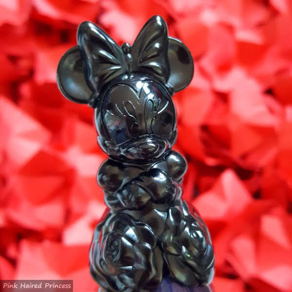 close up of front of Anna Sui Minnie Mouse shaped nail polish bottle