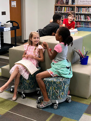 students reading in the library