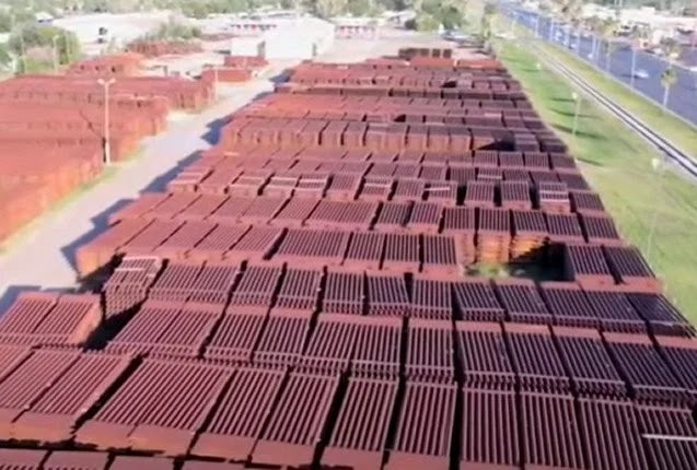 Border wall pieces sit on the ground as a record number of illegal aliens flood across the border.