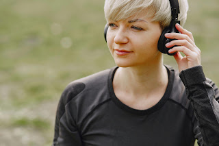 Photo by Gustavo Fring: https://www.pexels.com/photo/peaceful-woman-listening-to-music-with-headphones-in-nature-4127511/