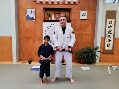 Professor Adam Evans with the Suha Auckland Kids BJJ