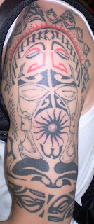 tribal tattoos on arm and shoulder