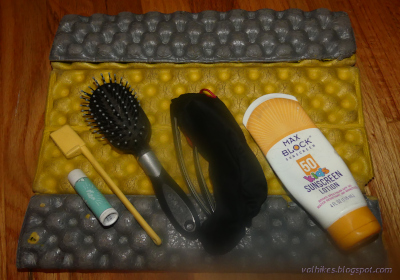 sunscreen and brushes on sit pad