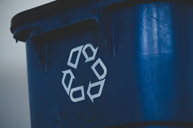 The recycling symbol visible on a bin